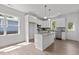 Modern kitchen with white cabinets, granite countertops, and stainless steel appliances at 815 Goshen St, Oxford, NC 27565