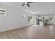 Bright, open-concept living room with hardwood floors leading to a modern, well-lit kitchen at 815 Goshen St, Oxford, NC 27565