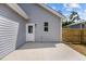 A cement patio with a door to the home and a newly installed privacy fence at 815 Goshen St, Oxford, NC 27565