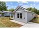 Charming single-story home with gray siding and manicured landscaping at 815 Goshen St, Oxford, NC 27565
