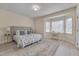 Cozy bedroom features a large bed, bright windows, and a comfortable workspace area at 8325 Wycombe Ln, Raleigh, NC 27615