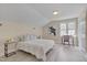 Cozy bedroom featuring a neutral color palette, and a sunlit window at 8325 Wycombe Ln, Raleigh, NC 27615