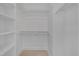 Walk-in closet with built-in shelving and hanging racks, providing ample storage space at 8325 Wycombe Ln, Raleigh, NC 27615