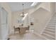 Cozy dining area with skylight, chandelier, and easy access to the kitchen at 8325 Wycombe Ln, Raleigh, NC 27615