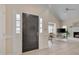 Bright entry foyer showcasing an open floor plan and sleek, light-colored flooring at 8325 Wycombe Ln, Raleigh, NC 27615