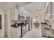 Efficient kitchen layout featuring stainless steel appliances and granite countertops at 8325 Wycombe Ln, Raleigh, NC 27615