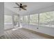Sunroom featuring wall to wall windows and a ceiling fan at 8325 Wycombe Ln, Raleigh, NC 27615