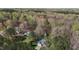 A house, outbuildings, mature trees, and a long driveway are all visible in this aerial shot at 85 Rolling Cloud Dr, Louisburg, NC 27549