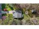 The property has a well-manicured lawn and outbuildings surrounded by trees, as seen from above at 85 Rolling Cloud Dr, Louisburg, NC 27549