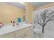 Bathroom featuring a sleek vanity with stylish fixtures and a shower with a tree-themed curtain at 85 Rolling Cloud Dr, Louisburg, NC 27549