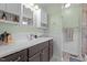 Bathroom boasts a vanity with plenty of counter space, plus a shower with modern fixtures at 85 Rolling Cloud Dr, Louisburg, NC 27549