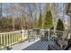 Spacious deck features outdoor seating and serene views of the surrounding backyard at 85 Rolling Cloud Dr, Louisburg, NC 27549