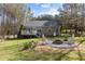 Backyard with a deck and a fire pit, perfect for relaxing and entertaining guests outdoors at 85 Rolling Cloud Dr, Louisburg, NC 27549
