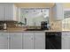 This kitchen features ample counter space, modern appliances, and a view to other rooms at 85 Rolling Cloud Dr, Louisburg, NC 27549