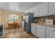 Spacious kitchen showcasing stainless steel appliances, ample cabinet space, and adjacent breakfast nook at 85 Rolling Cloud Dr, Louisburg, NC 27549