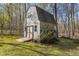 This is a view of the property's wooden outbuilding, offering potential for storage or a hobby space at 85 Rolling Cloud Dr, Louisburg, NC 27549