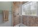 Shower features a glass enclosure, tiled walls, and built-in shelving, with handicap-accessible features at 85 Rolling Cloud Dr, Louisburg, NC 27549