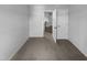 A bright bedroom featuring neutral walls and carpeting, awaiting personal touches at 932 Mailwood Dr, Knightdale, NC 27545