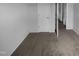 Hallway featuring neutral carpet, with white walls and doors adding to the clean aesthetic at 932 Mailwood Dr, Knightdale, NC 27545