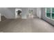 Spacious living room with easy access to kitchen and backyard doors at 932 Mailwood Dr, Knightdale, NC 27545