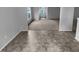 Open-concept living space with a view from the hard surface flooring to the carpeted living room at 932 Mailwood Dr, Knightdale, NC 27545