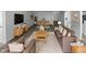 Bright living room featuring modern furniture, a TV, and an adjacent dining area, creating an inviting space at 932 Mailwood Dr, Knightdale, NC 27545