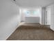 Cozy living room with soft carpet and ample natural light from the windows at 932 Mailwood Dr, Knightdale, NC 27545