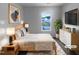 Comfortable main bedroom with a large window offering natural light and a view of the neighborhood at 932 Mailwood Dr, Knightdale, NC 27545