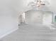 Large bonus room with plush carpet, neutral paint, and an entrance to another room via a small staircase at 9744 Bear Run Ln, Middlesex, NC 27557
