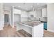 Modern kitchen featuring white cabinets, granite countertops, a subway tile backsplash, and stainless steel appliances at 9744 Bear Run Ln, Middlesex, NC 27557