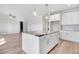 Well-lit kitchen featuring a large island, granite countertops, and stainless steel appliances at 9744 Bear Run Ln, Middlesex, NC 27557