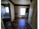 A full bathroom with a tub and shower, toilet, and a window for ventilation at 1004 Fuller St, Smithfield, NC 27577