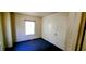 This bedroom features a window letting in natural light, and a door at 1004 Fuller St, Smithfield, NC 27577