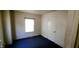 Cozy bedroom with a window and neutral walls at 1004 Fuller St, Smithfield, NC 27577