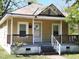 Charming bungalow-style home with a cozy front porch and classic architectural details at 1004 Fuller St, Smithfield, NC 27577