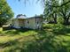 Traditional home with a well-maintained lawn and mature trees at 1004 Fuller St, Smithfield, NC 27577