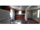 A kitchen that has cabinets and a sink, connecting to another room at 1004 Fuller St, Smithfield, NC 27577