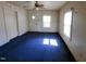 Bright living room featuring carpet and a ceiling fan at 1004 Fuller St, Smithfield, NC 27577