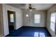 Well-lit living room with carpet at 1004 Fuller St, Smithfield, NC 27577