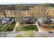 Aerial shot showcases a well-maintained home with a pool and landscaped front yard at 1005 Brookview Dr, Elon, NC 27244