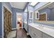 This ensuite bathroom has double sinks, a large mirror, and a stall shower at 1005 Brookview Dr, Elon, NC 27244