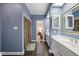 This ensuite bathroom has double sinks, a large mirror, and a stall shower at 1005 Brookview Dr, Elon, NC 27244