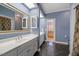 This ensuite bathroom has double sinks, a large mirror, and a stall shower at 1005 Brookview Dr, Elon, NC 27244