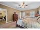 Bedroom features a ceiling fan and two windows for natural light at 1005 Brookview Dr, Elon, NC 27244