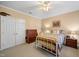 This traditional bedroom has carpeted floors, neutral walls, and white closets at 1005 Brookview Dr, Elon, NC 27244