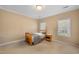 This is a neutral bedroom with natural light, carpet, and double closets at 1005 Brookview Dr, Elon, NC 27244