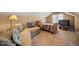 Cozy bedroom featuring a comfortable couch, bed, and television, perfect for relaxation and entertainment at 1005 Brookview Dr, Elon, NC 27244