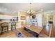 Casual dining area features a rustic table, bench seating, and a view into the kitchen at 1005 Brookview Dr, Elon, NC 27244