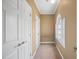Hallway with arched window, doors, and neutral carpet at 1005 Brookview Dr, Elon, NC 27244