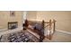 Hallway featuring a wooden bench and ornate rug on carpeted floor at 1005 Brookview Dr, Elon, NC 27244